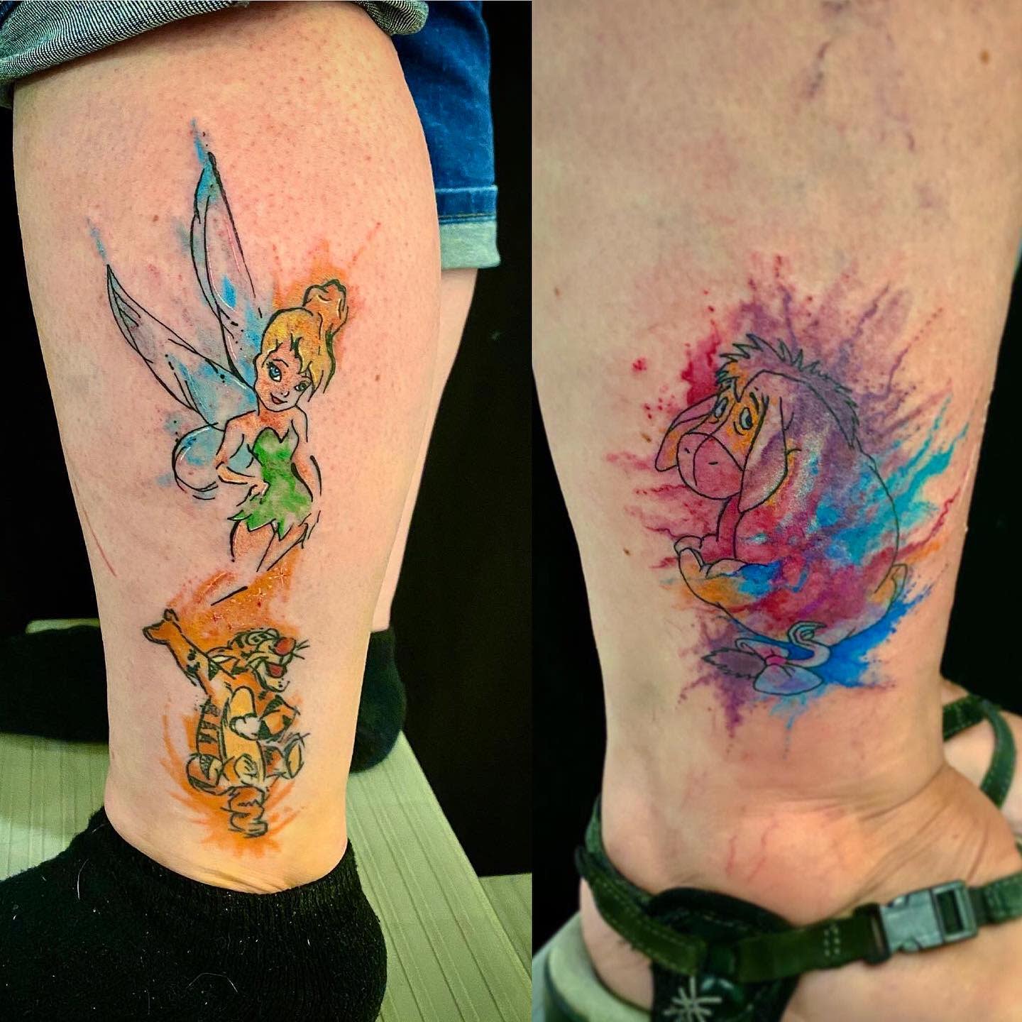 Two tattoos: Tinkerbell and Tigger on one leg, and a watercolor-style Eeyore on the other